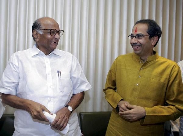 Shiv Sena President Uddhav Thackeray with NCP chief Sharad Pawar after he was chosen as the nominee for Maharashtra chief minister's post by Shiv Sena-NCP-Congress alliance, during a meeting in Mumbai, Tuesday, November 26, 2019. Credit: PTI Photo