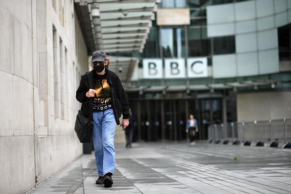 People walk outside the BBC headquarters in Portland Place, London on July 2, 2020. Credit: AFP Photo