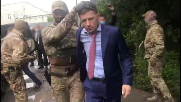 Members of Russian security forces detain Governor of Khabarovsk Region Sergei Furgal, accused of crimes including attempted murder, in Khabarovsk Region, Russia. Credit: Reuters Photo