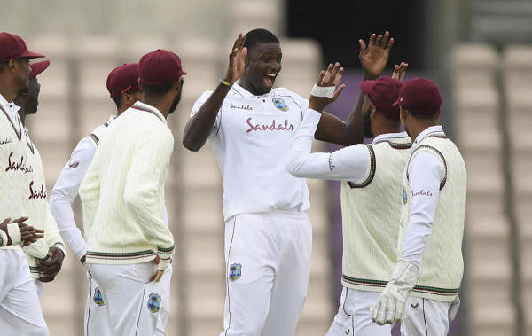  West Indies' captain Jason Holder, third right, celebrates with teammates the dismissal of England's Jofra Archer during the second day of the first cricket Test match between England and West Indies, at the Ageas Bowl in Southampton, England, Thursday, July 9, 2020. Credit: Reuters