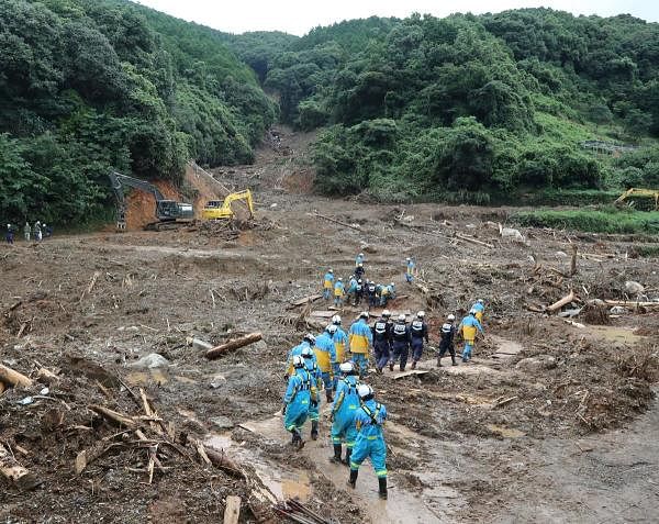 Rescue workers search for missing people at a landslide site caused by heavy rain in Tsunagi, Kumamoto prefecture on July 10, 2020. Credit: AFP Photo