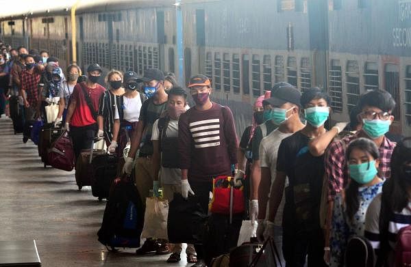 Nagaland returnees stand in a queue to board a bus to reach their respective districts after arriving via special train, during the ongoing Covid-19 lockdown, in Dimapur, Saturday, June 13, 2020. Credit: PTI Photo
