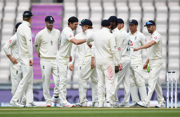 England's James Anderson celebrates with teammates after taking the wicket of West Indies' Shamarh Brooks, as play resumes behind closed doors following the outbreak of the coronavirus disease. Credit: Reuters Photo