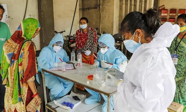 Health workers prepare for conducting rapid antigen testing for diagnosis of Covid-19 cases. Credit: PTI Photo