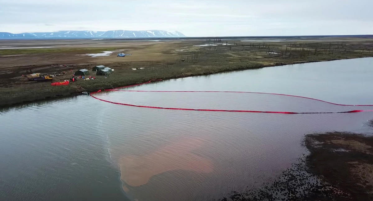 Rescuers work at the site of a huge leak of fuel into the river after an accident at a power plant outside Norilsk, Russia. File Photo. Credit: Reuters Photo