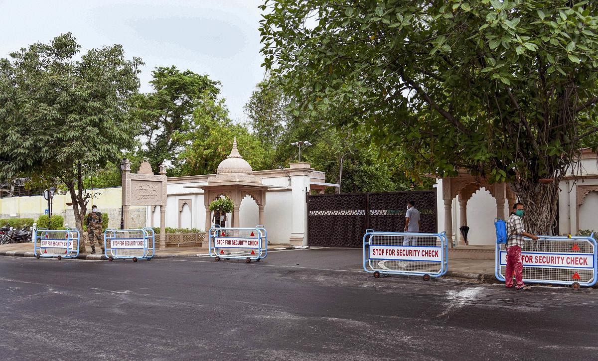 Security personnel stand guard outside the official residence of Rajasthan Chief Minister Ashok Gehlot, amid the political crisis over the alleged attempts to topple the Congress government. Credit: PTI Photo
