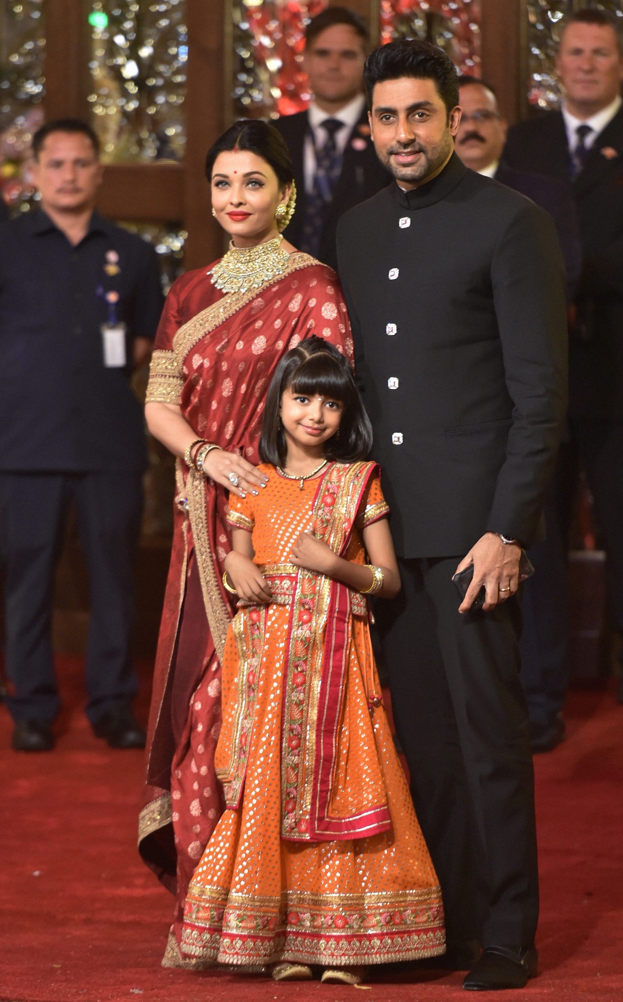 Bollywood actor Aishwarya Rai Bachchan with husband-actor Abhishek Bachchan and daughter Aaradhya arrives to attend the wedding ceremony of industrialist Mukesh Ambani's daughter. Credit: PTI