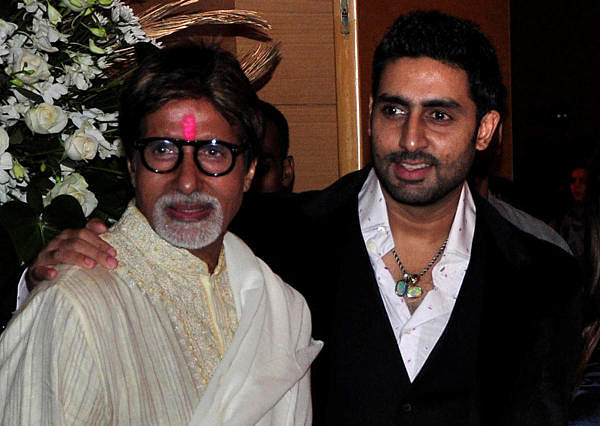 Bollywood actors Amitabh Bachchan (L) and his son Abhishek Bachchan (R) pose for a picture. Credit: Reuters Photo