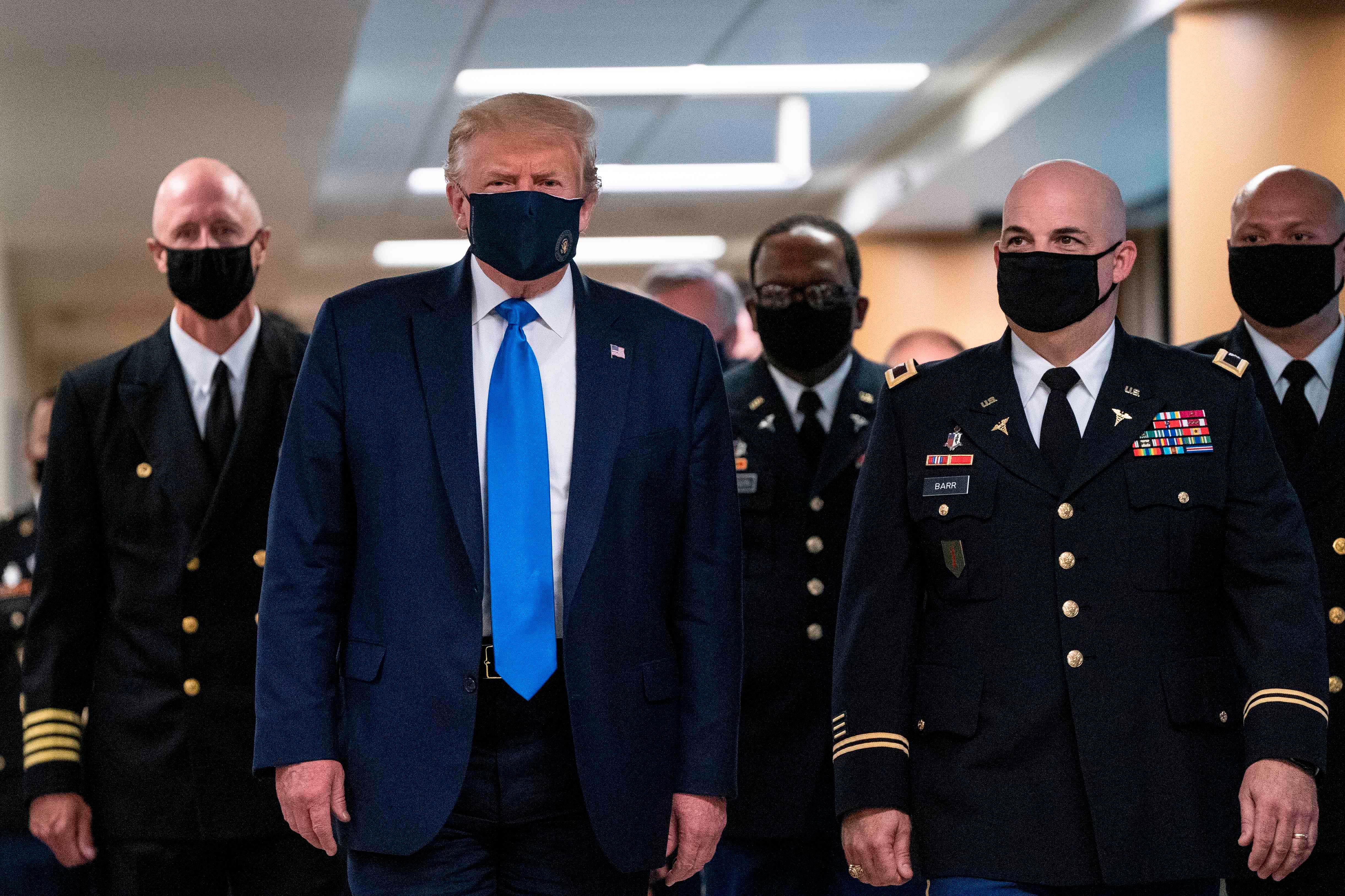  US President Donald Trump wears a mask as he visits Walter Reed National Military Medical Center in Bethesda, Maryland' on July 11, 2020. Credit: AFP