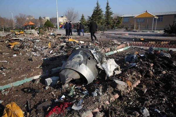 Rescue teams work amidst debris after a Ukrainian plane carrying 176 passengers crashed near Imam Khomeini airport in the Iranian capital Tehran. Credit: AFP