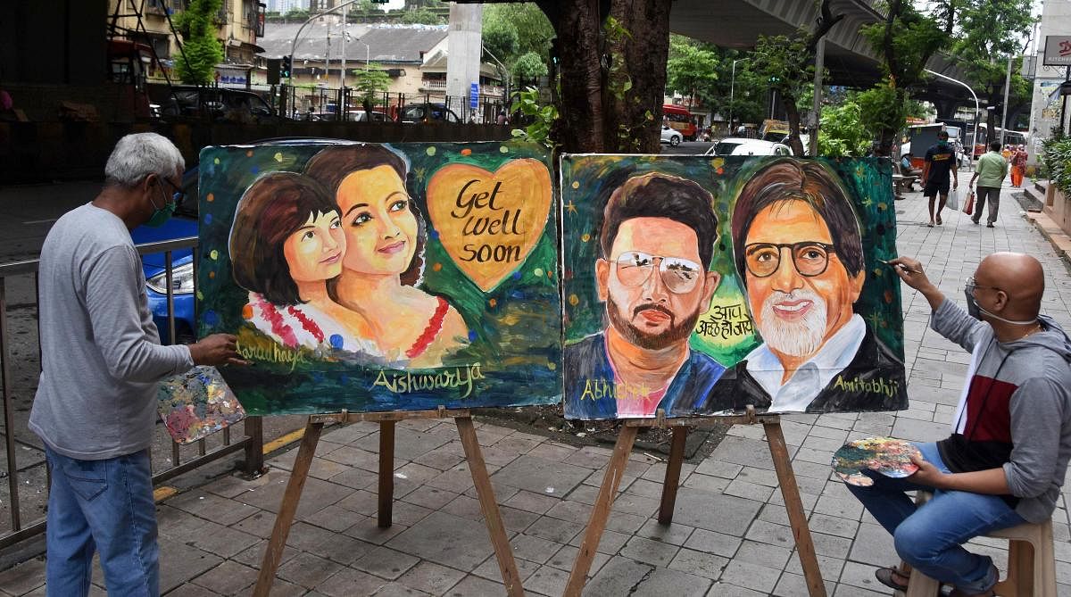 Gurukul students and teachers create paintings of Bollywood actor Amitabh Bachchan and his family members, after they tested positive for Covid-19, at Lalbaug, in Mumbai. Credit: PTI Photo