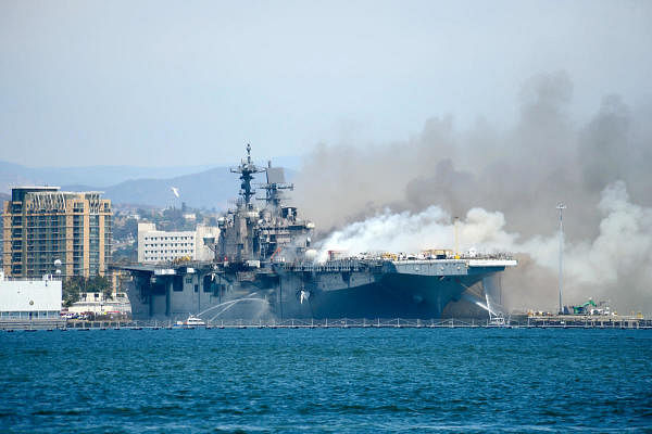 Port of San Diego Harbor Police Department boats combat a fire on board the US Navy amphibious assault ship USS Bonhomme Richard at Naval Base San Diego. Credit: Reuters