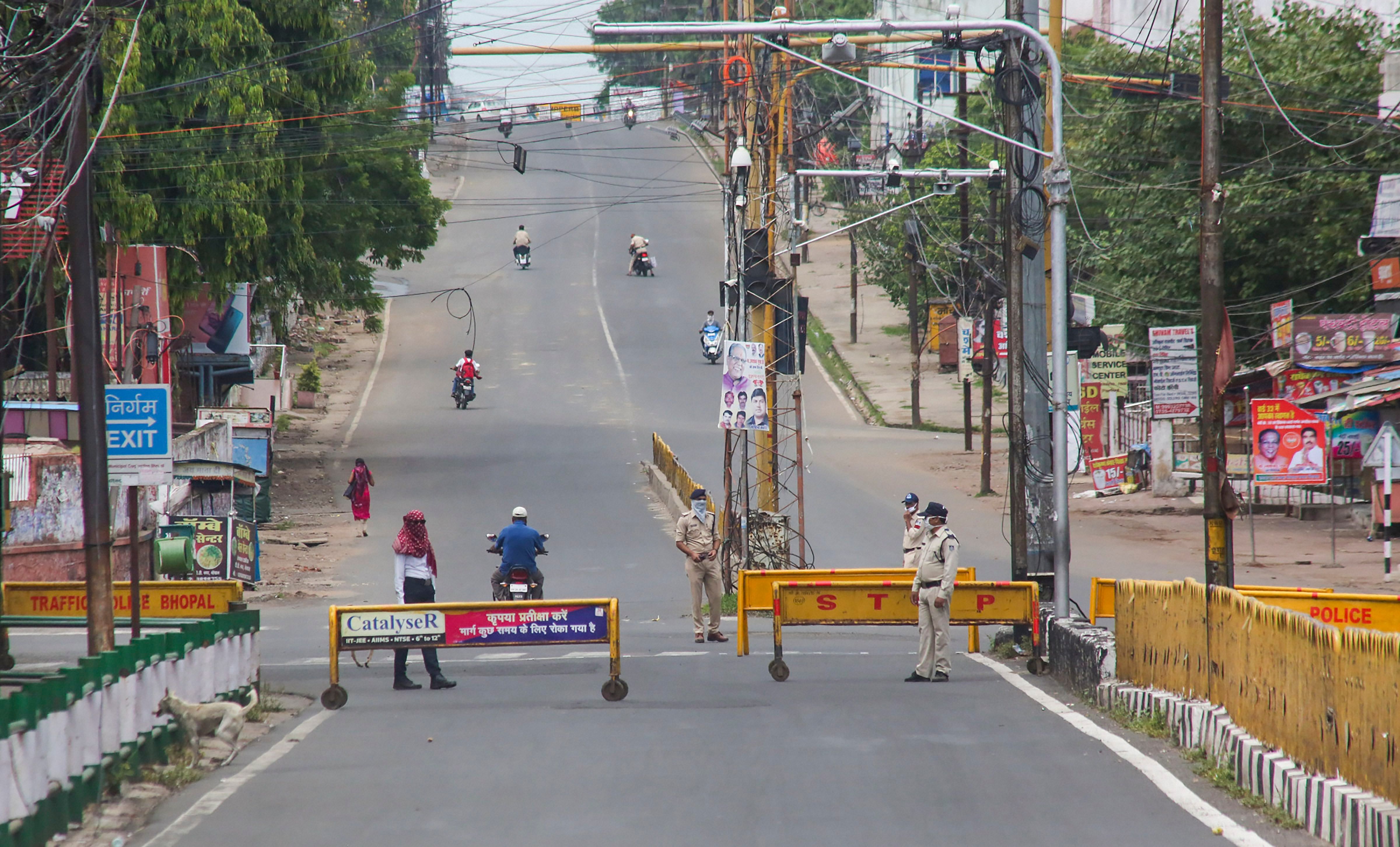 Roads wear almost deserted look during a complete lockdown imposed to curb the coronavirus pandemic, in Bhopal. Credits: PTI Photo