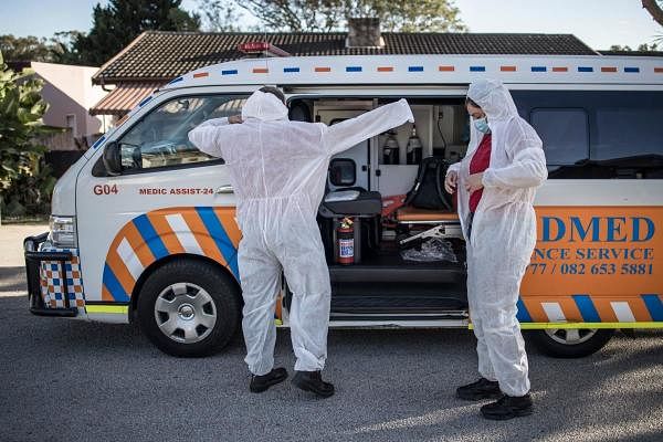 A crew of a private ambulance service in Port Elizabeth wear PPE. Credit: AFP