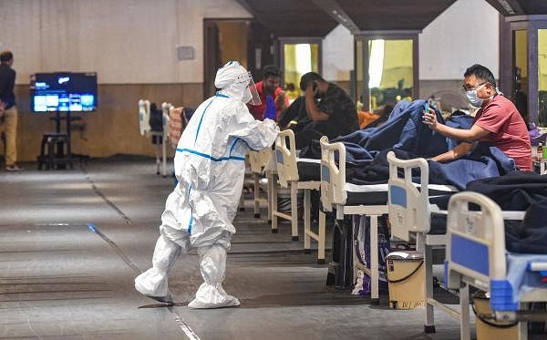 Covid-19 patients inside an isolation ward in Shehnai Banquet Hall near LNJP Hospital, in New Delhi. Credit: PTI Photo