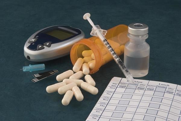 A picture of pills and diabetic supplies. Credit: Getty Images