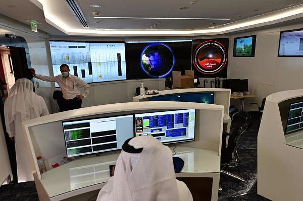 Employees work at the control room of the Mars Mission at the Mohammed Bin Rashid Space Centre. Credit: AFP