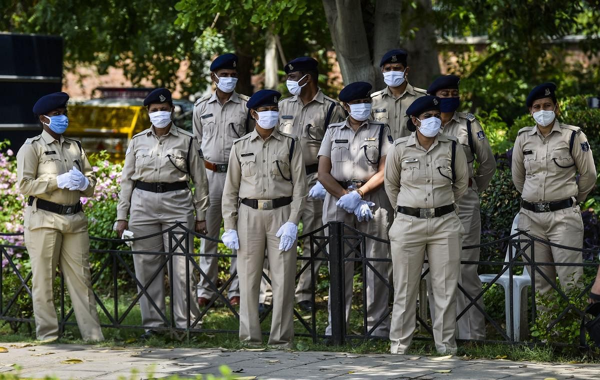  Security personnel wear face masks in the wake of coronavirus pandemic, during Unlock 2.0, in New Delhi, Saturday, July 11, 2020. Credit: PTI Photo