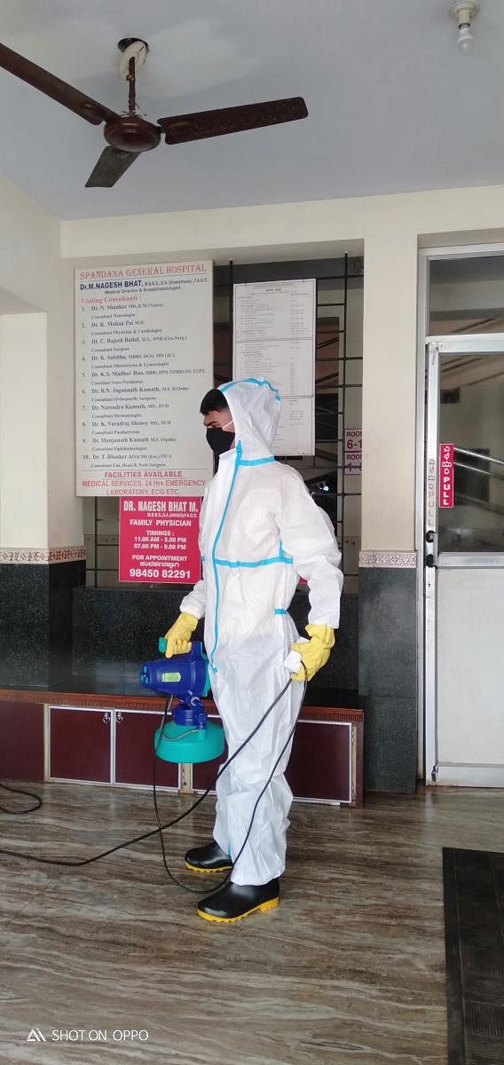 Manoj Kumar, wearing Personal Protective Equipment (PPE) seen sanitising an institution in Mangaluru.