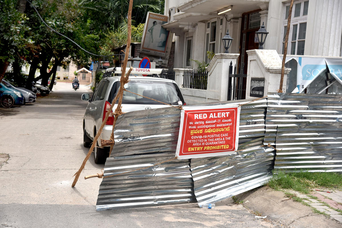 A stretch of Richmond Road was blocked after a Covid positive case was reported. DH Photo/S K Dinesh