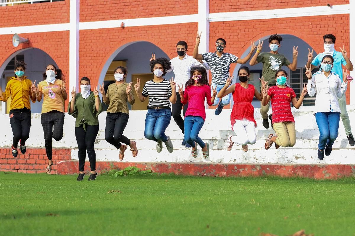 Students celebrate after CBSE announced class 12th results, at a school in Rohtak, Monday, July 13, 2020. PTI