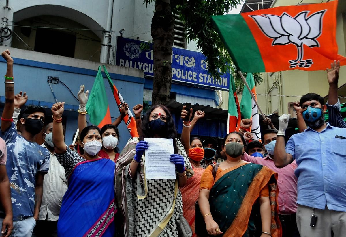 BJP Mohila Morcha President Agnimitra Paul (C) along with party workers raises slogans during a demonstration against the alleged murder of party MLA Debendra Nath Roy. Credit: PTI Photo