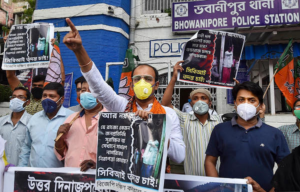 BJP activists display placards and raise slogans during a protest demanding justice for party leader Late Debendra Nath Roy, in Kolkata, Wednesday, July 15, 2020. Credit: PTI Photo