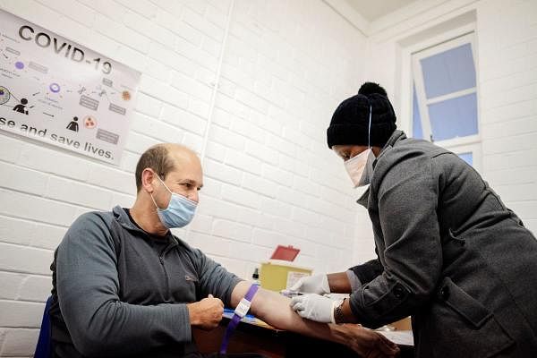 A person receives the experimental vaccine for Covid-19. Credit: AFP