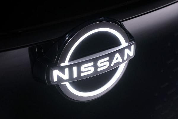 Nissan Motor emblem on the company's new electric SUV, Ariya, during a press preview at the Nissan Pavilion in Yokohama. Credit: AFP Photo