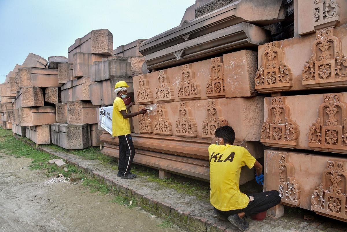 Workers clean the stones at Ram Janmabhoomi Nyas Karyashala in Ayodhya (PTI Photo)