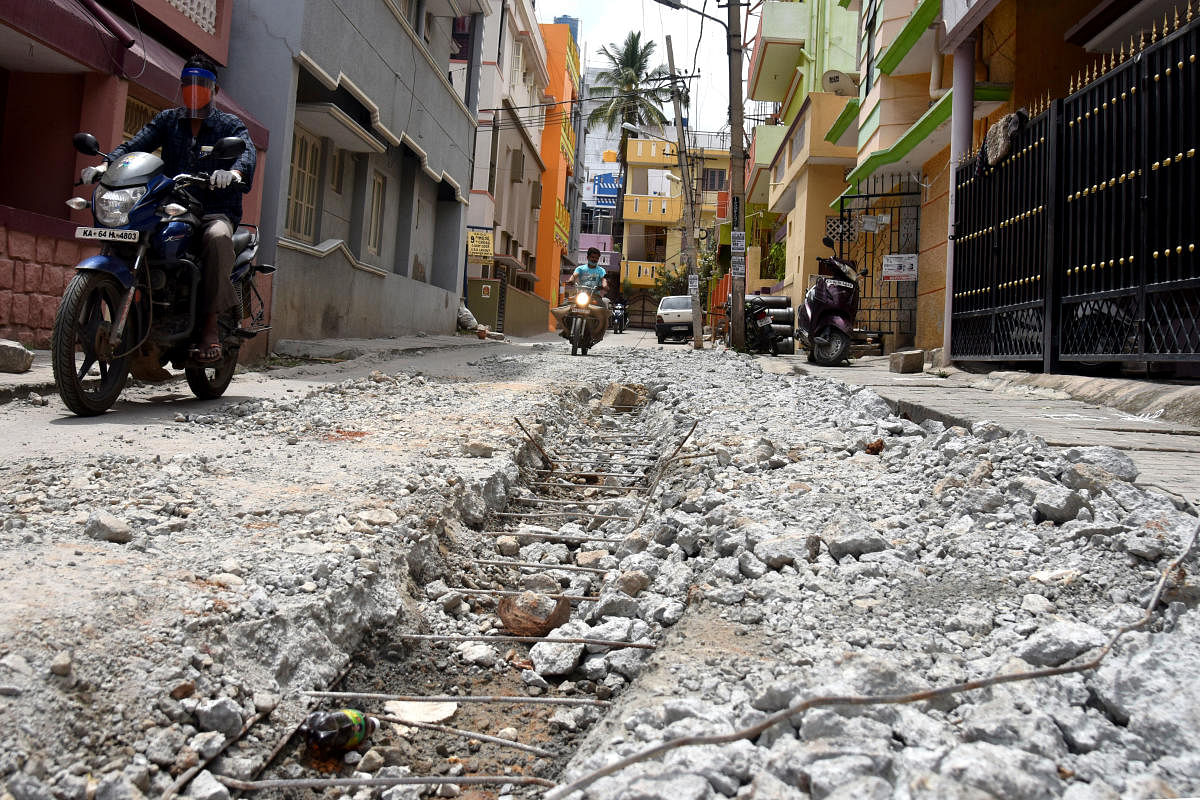 Civic authorities dug up the concrete road 10 days ago, but failed to close it. DH PHOTO/S K Dinesh
