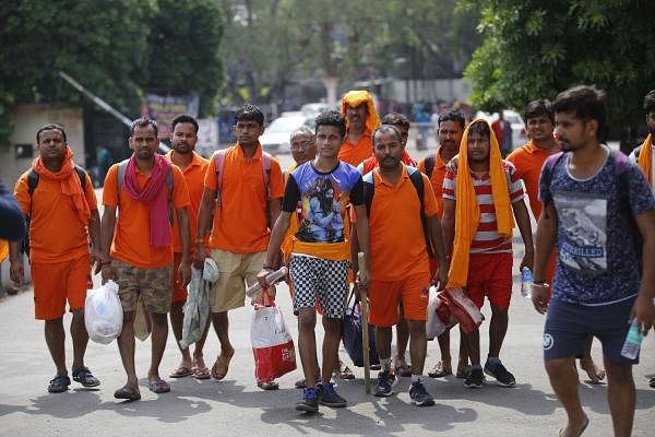 Pilgrims of Amarnath yatra prepare to leave from Jammu Railway Station, in Jammu. Credit: PTI