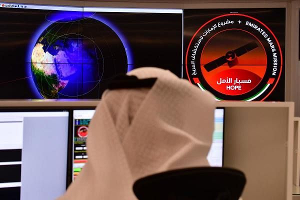 An employee works at the control room of the Mars Mission at the Mohammed Bin Rashid Space Centre (MBRSC), in the Gulf city of Dubai. Credit: AFP Photo