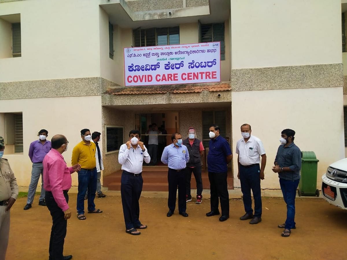 Deputy Commissioner R Girish inspects the Covid Care Centre at Sri Dharmasthala Manjunatha Ayurveda College in Hassan. DH PHOTO