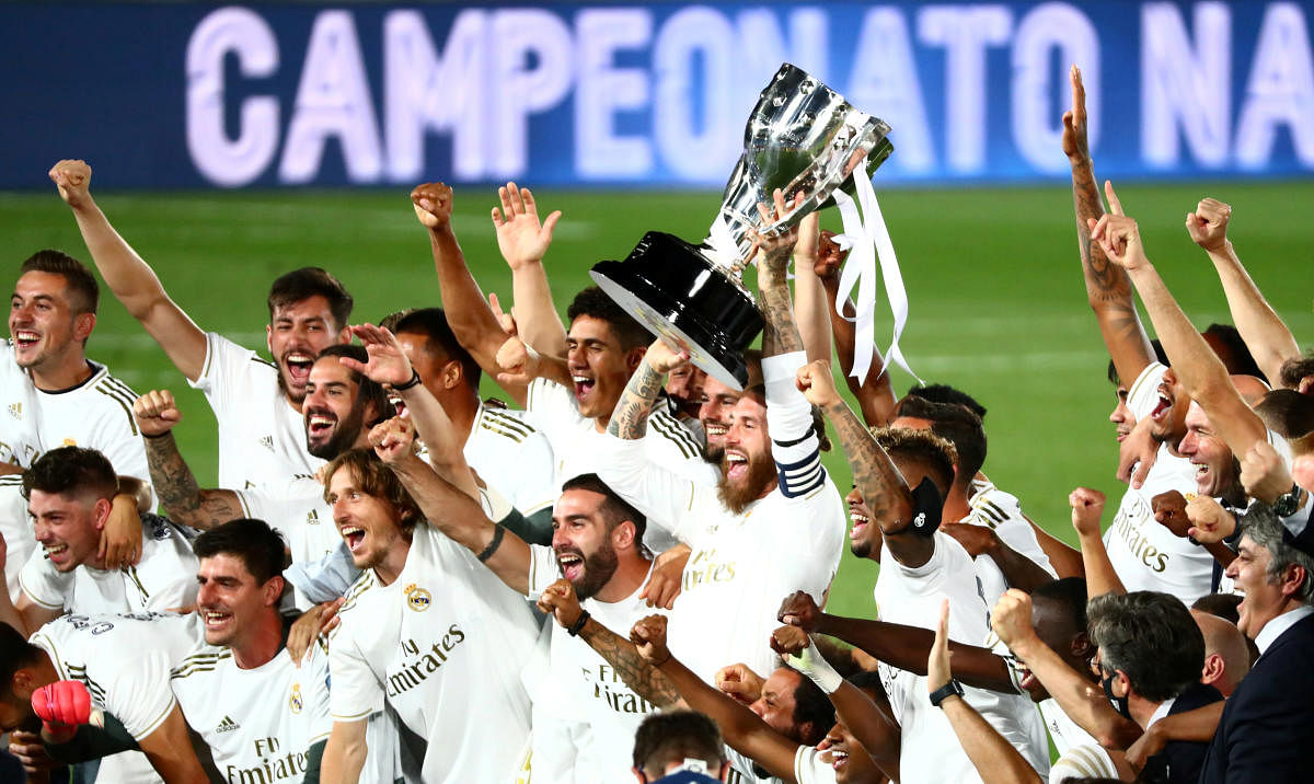 Real Madrid's Sergio Ramos and teammates celebrate with the trophy after winning La Liga, as play resumes behind closed doors following the outbreak of the coronavirus disease (Covid-19). Credit: REUTERS