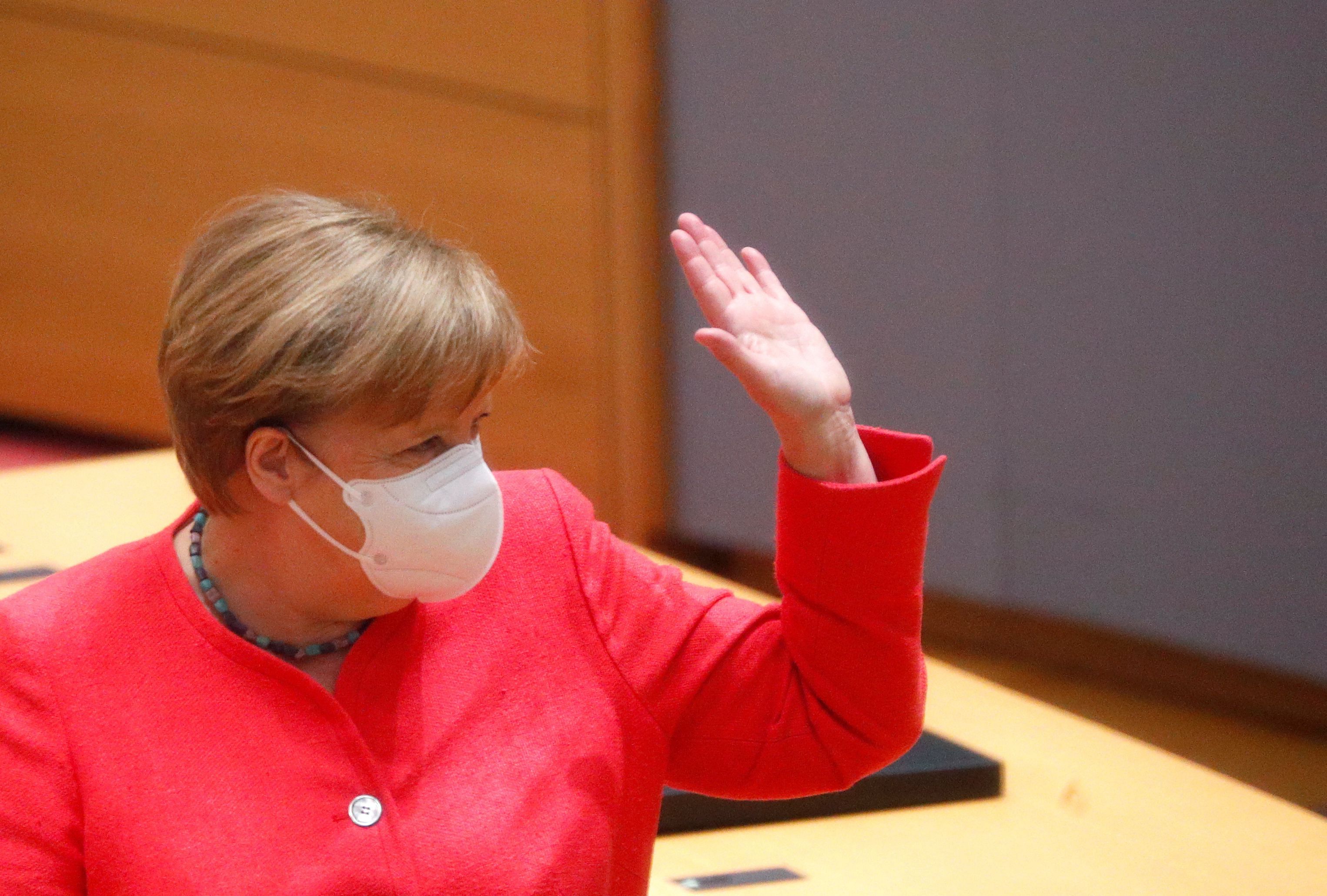 German Chancellor Angela Merkel waves at the start of the first face-to-face EU summit since the coronavirus disease (COVID-19) outbreak, in Brussels, Belgium July 17, 2020. Credit: REUTERS