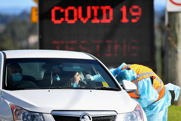 A member of the public is seen getting a test for the coronavirus disease (Covid-19) at the Crossroads Hotel testing centre following a cluster of infections in Sydney, Australia. Credit: Reuters Photo