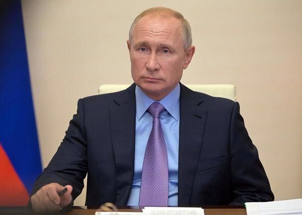 Russian President Vladimir Putin chairing a video conference meeting . Credit: AFP Photo