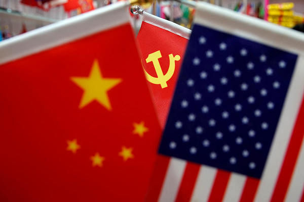 The flags of China, U.S. and the Chinese Communist Party. Credit: Reuters Photo