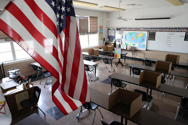 Social distancing dividers for students are seen in a classroom at St. Benedict School, amid the outbreak of the coronavirus disease (COVID-19), in Montebello, near Los Angeles, California, U.S., July 14, 2020. Credit: Reuters Photo