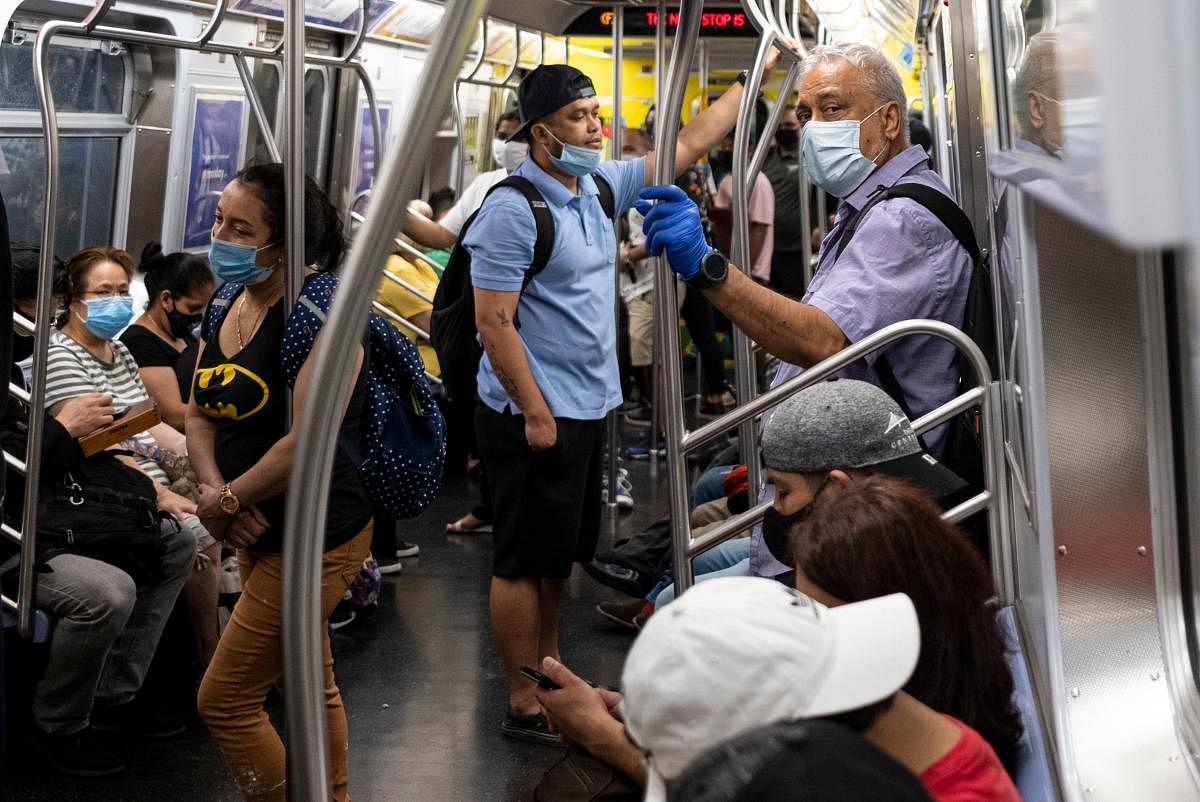 People stand in a subway train during rush hour amid the coronavirus pandemic on July 16, 2020 in New York City.  Credit: AFP Photo