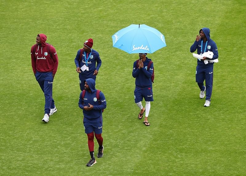 West Indies' Jason Holder and teammates walk on the pitch as play is abandoned for the day, as play resumes behind closed doors following the outbreak of the coronavirus. Credits: Reuters Photo