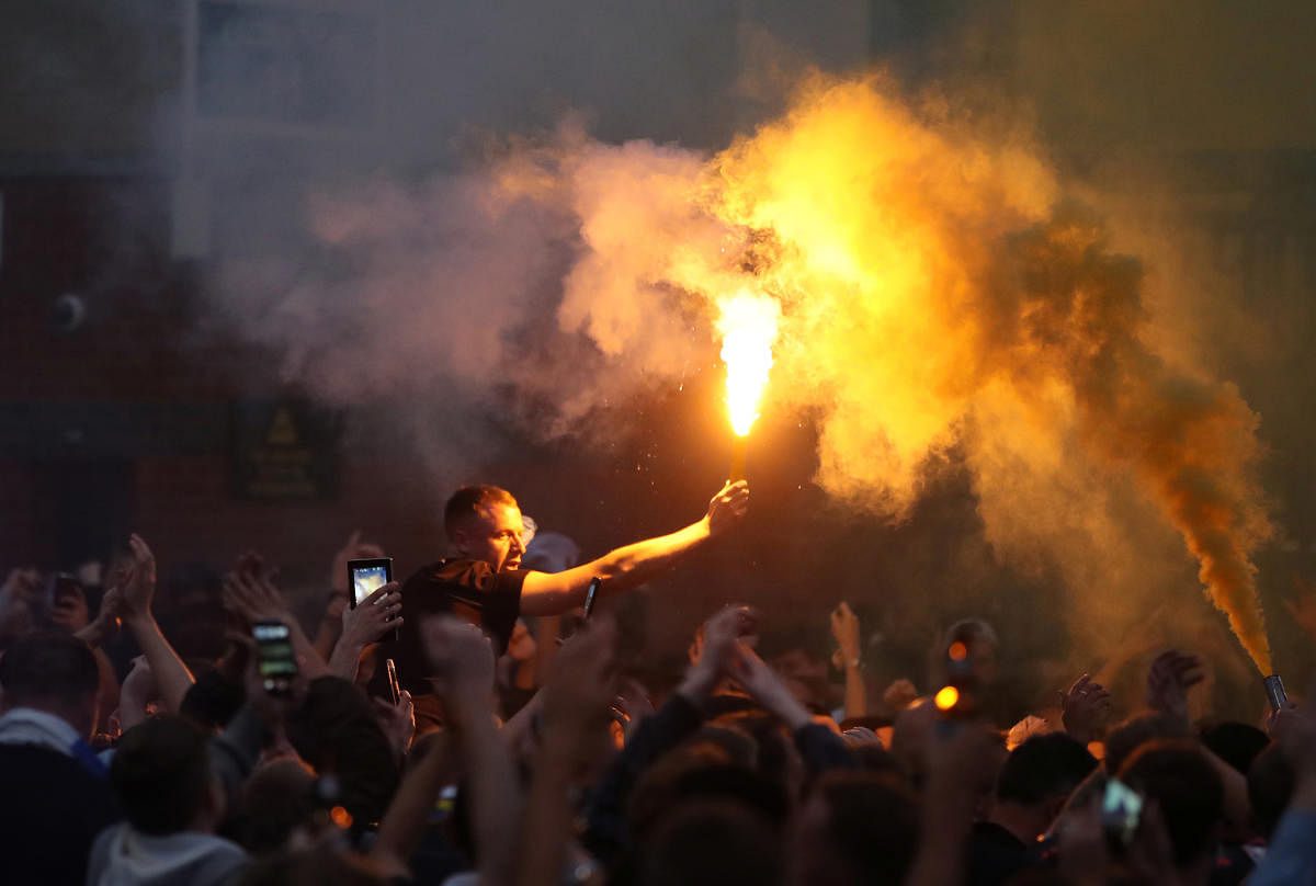 Leeds United fans celebrate promotion to the Premier League. Credit: Reuters