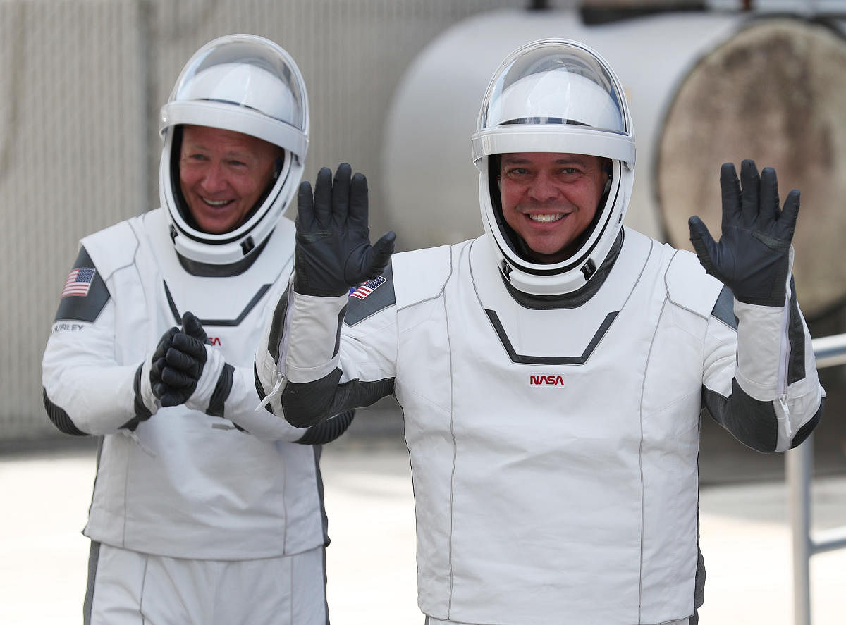  NASA astronauts Bob Behnken (R) and Doug Hurley. Credit AFP
