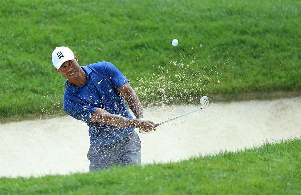 Tiger Woods of the United States plays his second shot on the fourth hole during the second round of The Memorial Tournament. Credit: AFP