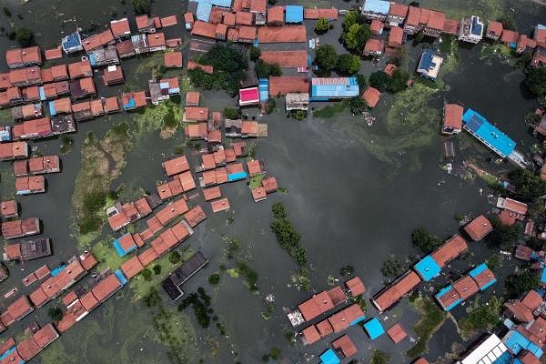 An aerial view shows flooded residential buildings due to rising water levels of the Yangtze river in Jiujiang, China's central Jiangxi province, on July 18, 2020. Credit: AFP Photo
