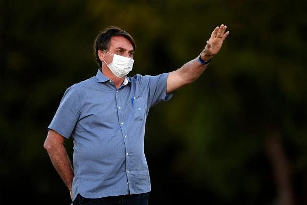 Brazilian President Jair Bolsonaro waves. Credit: AFP Photo