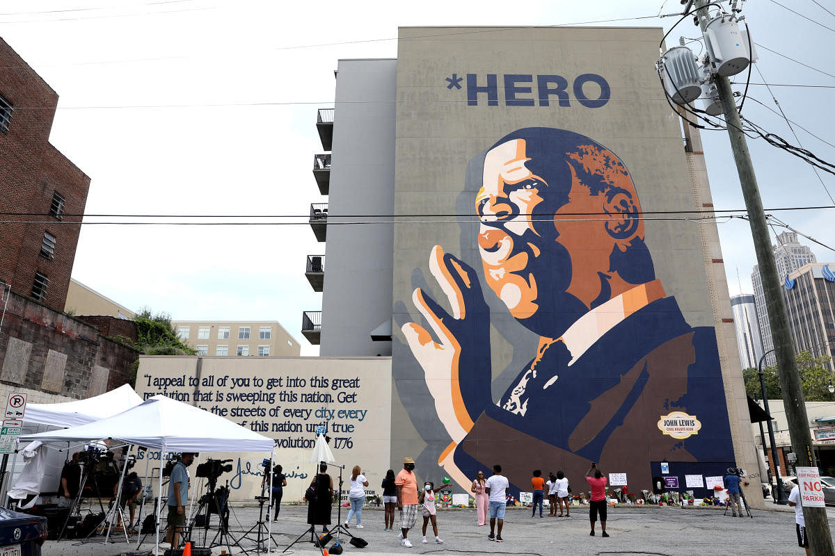 Mourners view a makeshift memorial to the passing of the late Rep. John Lewis, a pioneer of the civil rights movement and long-time member of the U.S. House of Representatives, under his mural in Atlanta, Georgia, U.S. Credit: Reuters