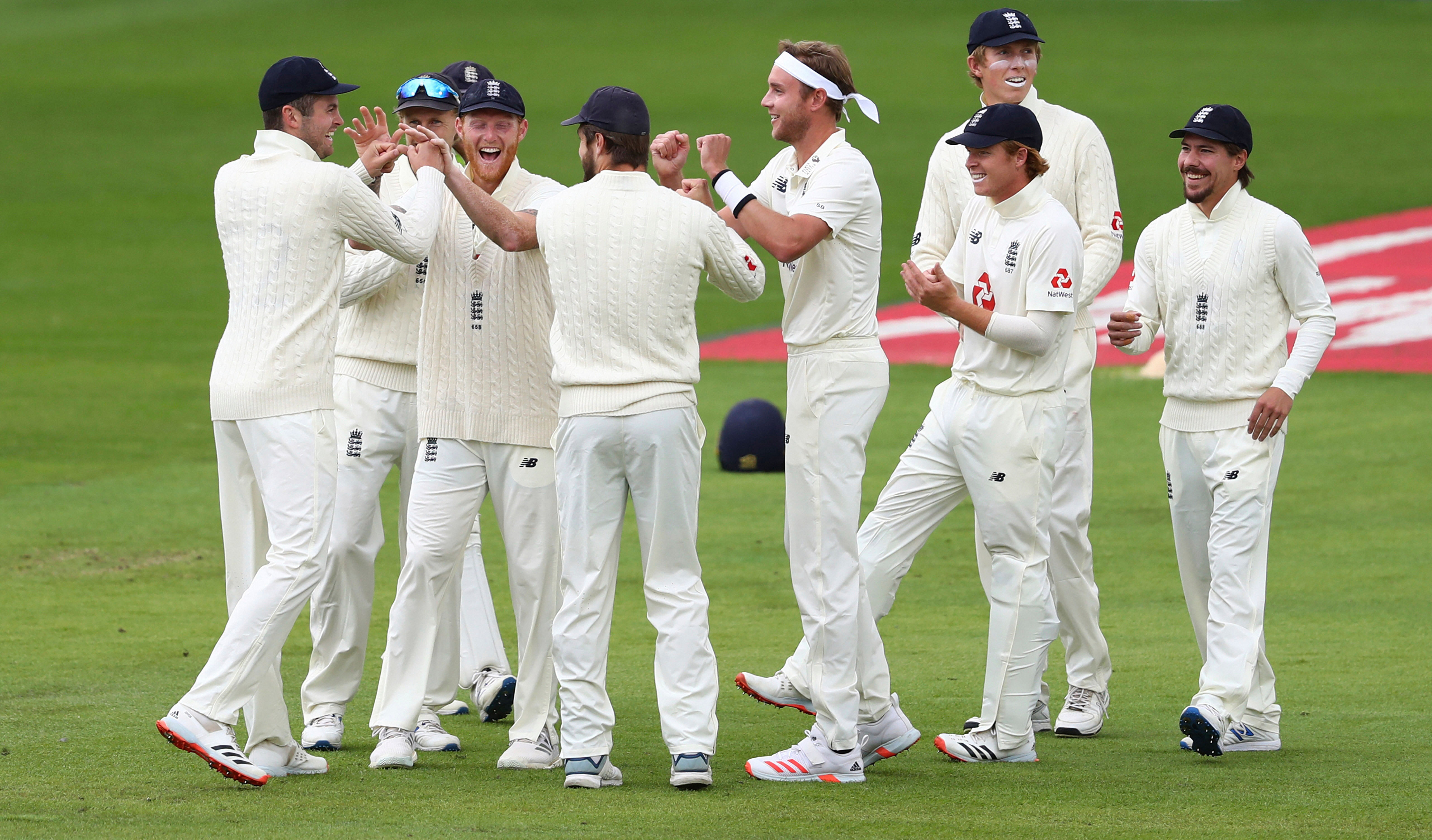 England's Stuart Broad, center, and teammates celebrate the dismissal of West Indies' John Campbell during the last day of the second cricket Test match between England and West Indies at Old Trafford. Credits: AP Photo