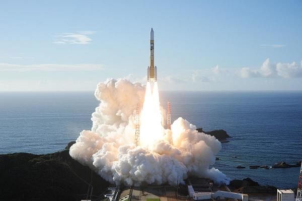 Mitsubishi Heavy Industries an H-2A rocket carrying the Hope Probe known as "Al-Amal" in Arabic, developed by the Mohammed Bin Rashid Space Centre (MBRSC) in the United Arab Emirates (UAE) to explore Mars, blasts off from Tanegashima Space Centre in southwestern Japan. Credit: AFP